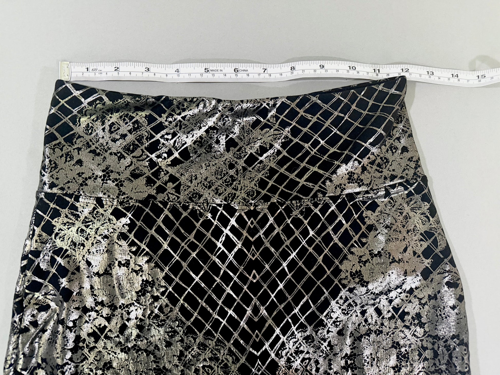 Waist measurement of Bebe metallic silver stretch mini skirt.
