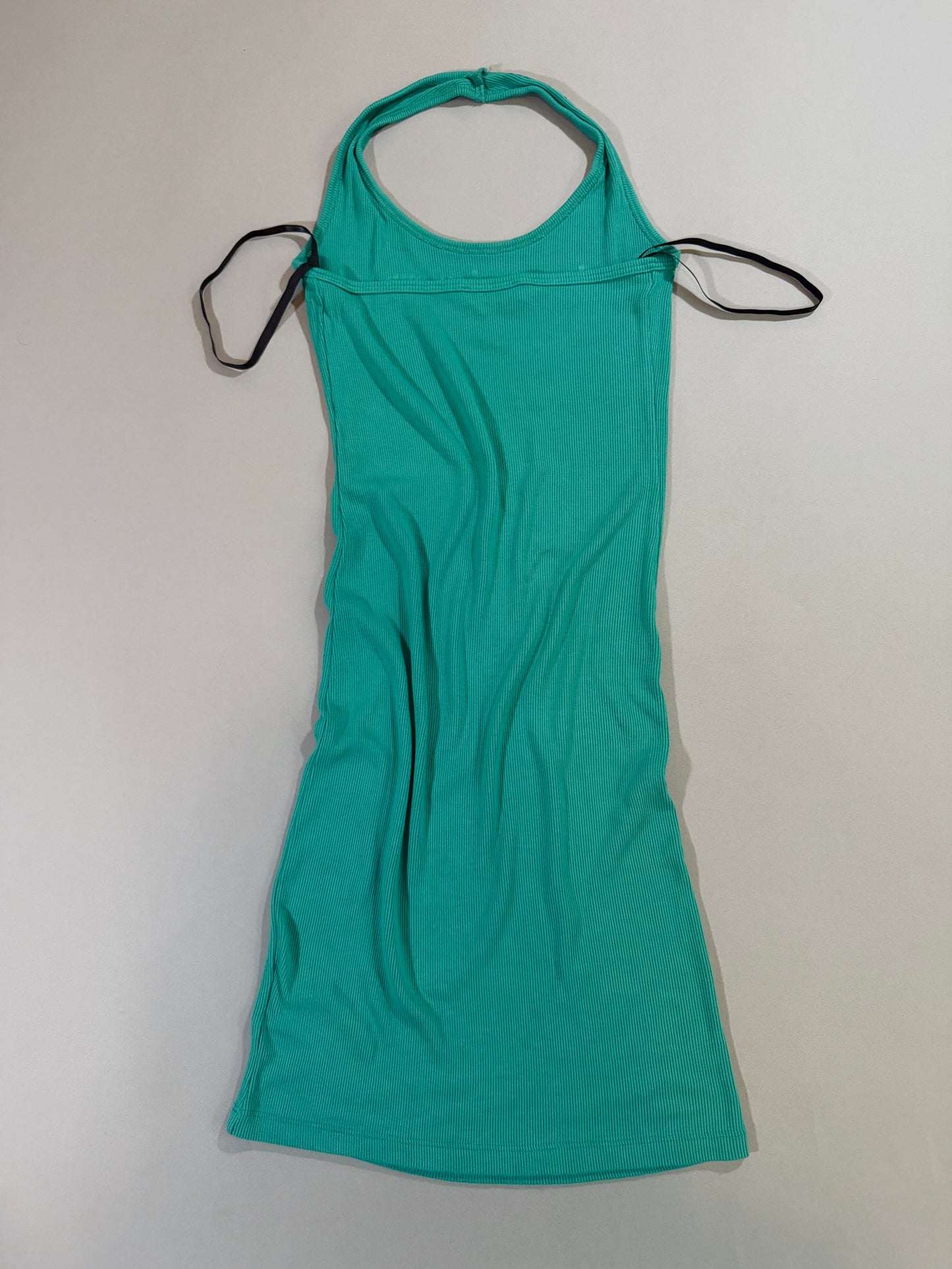 Back view of the turquoise ribbed Bebe halter mini dress.