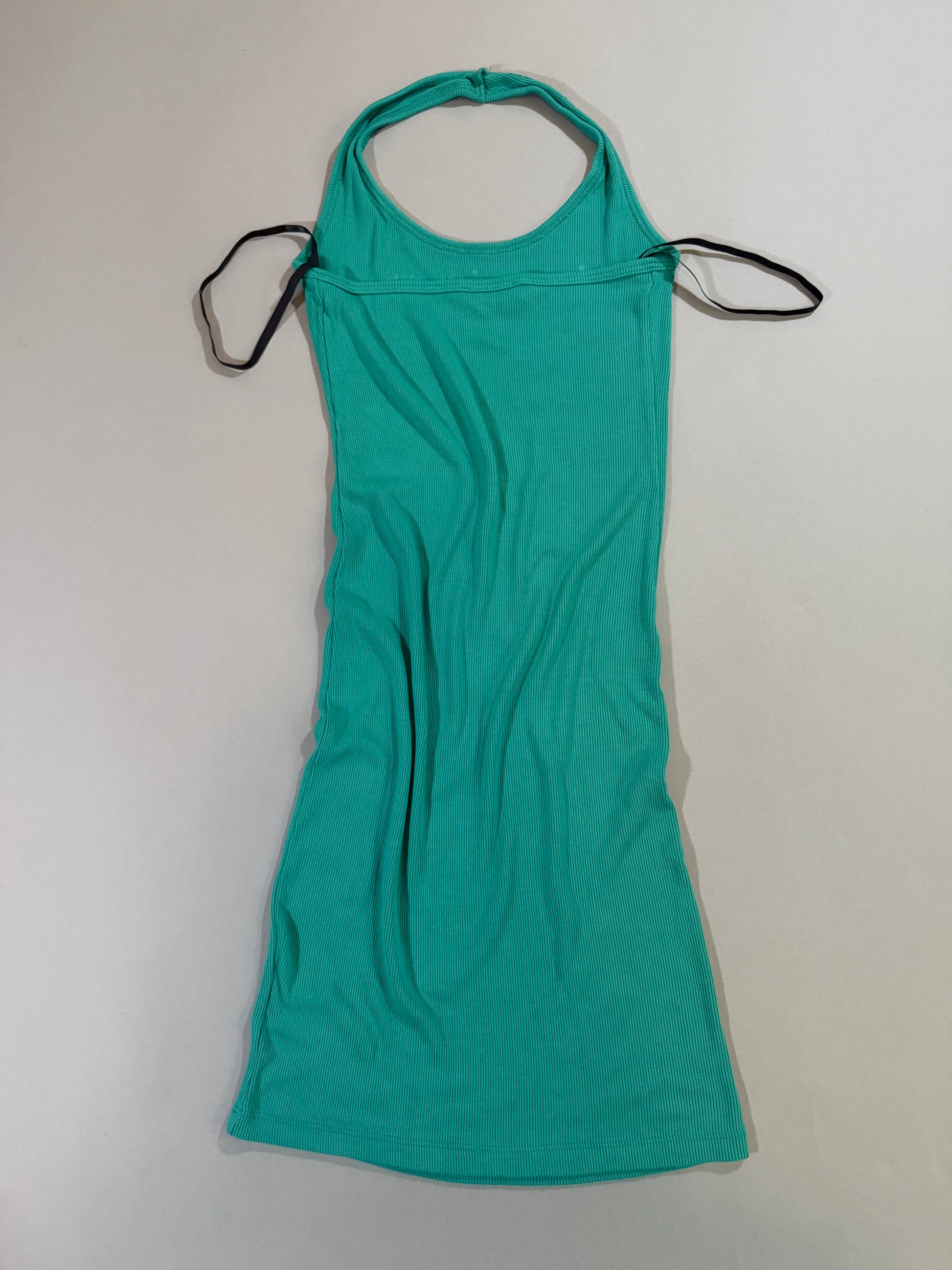 Back view of the turquoise ribbed Bebe halter mini dress.