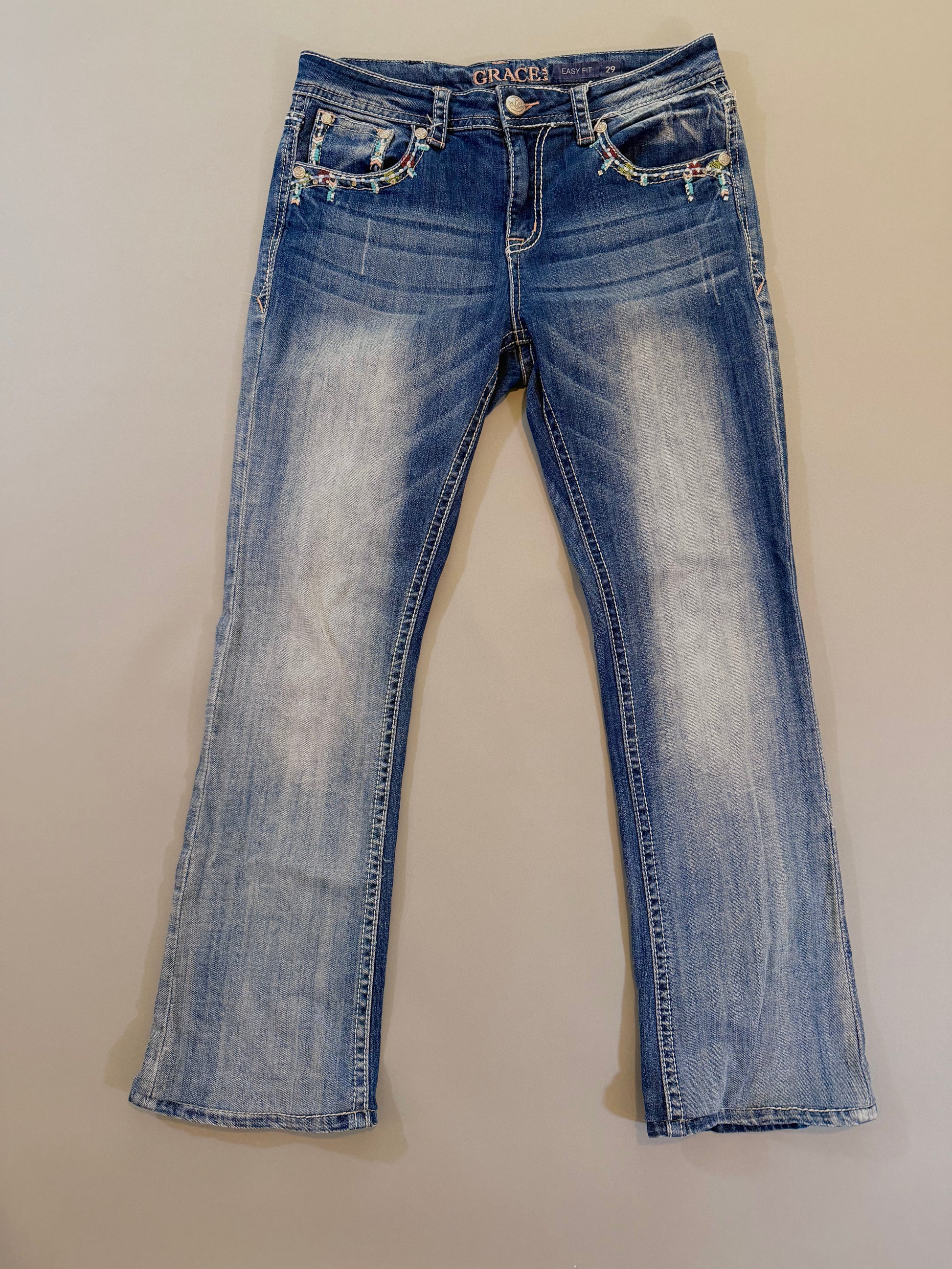 Front of y2k grace in LA boho jeans showing pocket embellishments and embroidery 