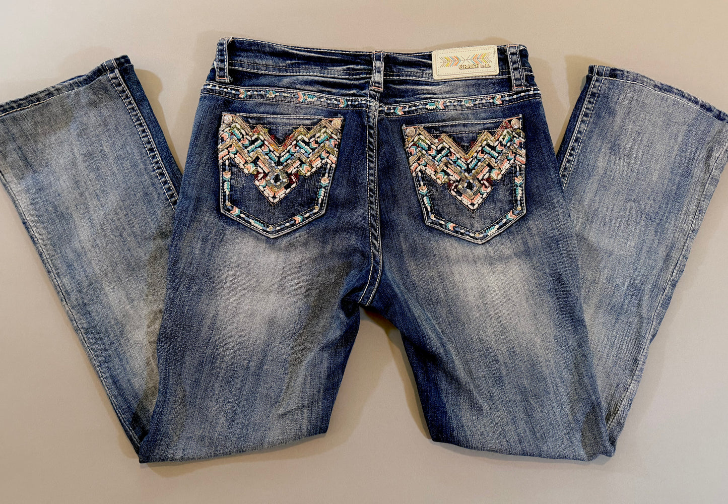 Y2k boho western rhinestone embellished denim jeans with pastel embroidered pockets by grace in LA