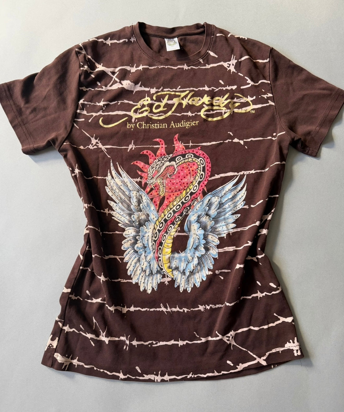 Photo of vintage Ed hardy tee in brown with alll over barbed wire print and rhinestone studded snake graphic. 