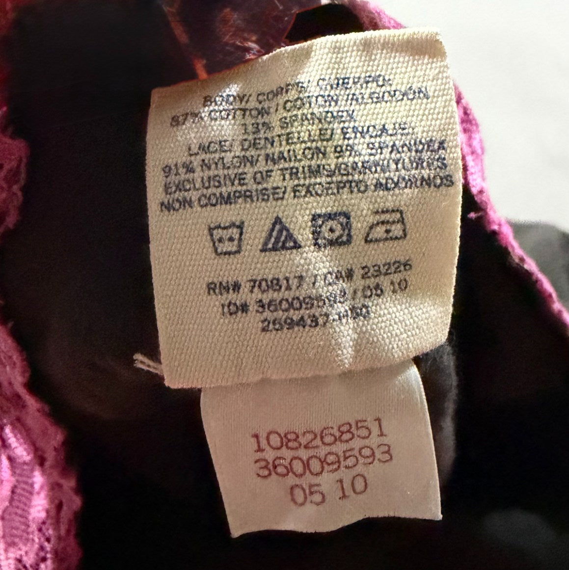VS PINK yoga pants care tag and codes label showing May 2010 manufacturing date. 