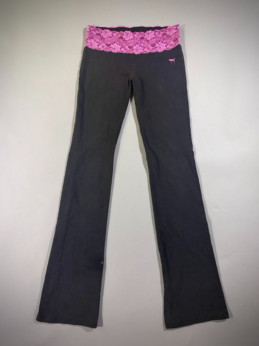 Full length photo of vintage low rise Victoria’s Secret yoga pants with pink lace waistband. 